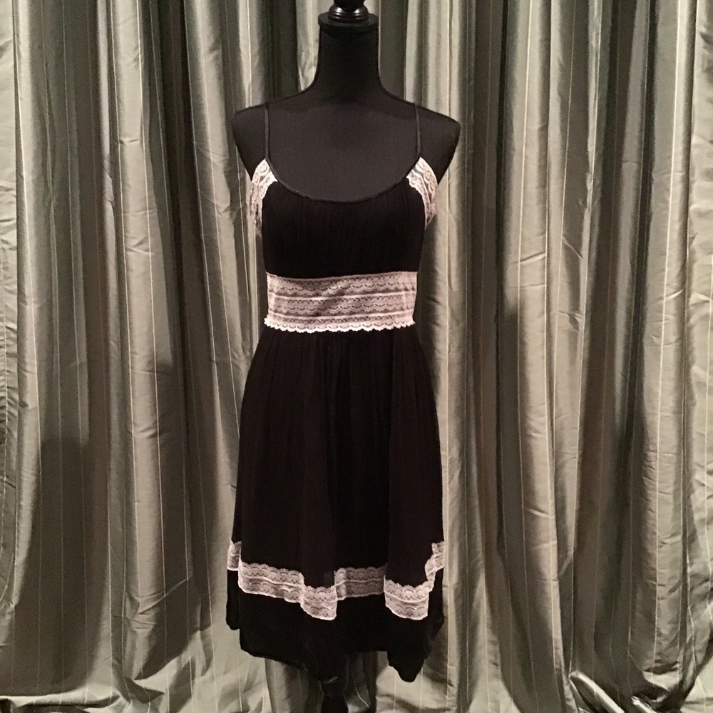 Beautiful black designer dress with white lace